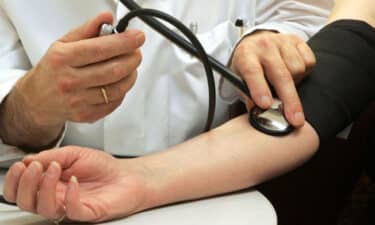 a doctor measuring blood pressure of a patient