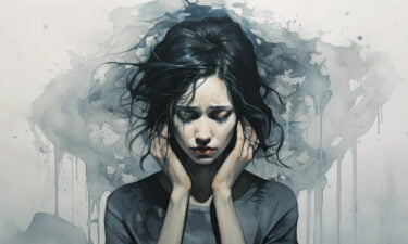 a woman with her hands on her face
